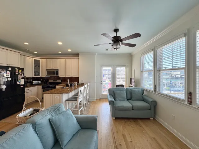 a dining room with furniture and wooden floor