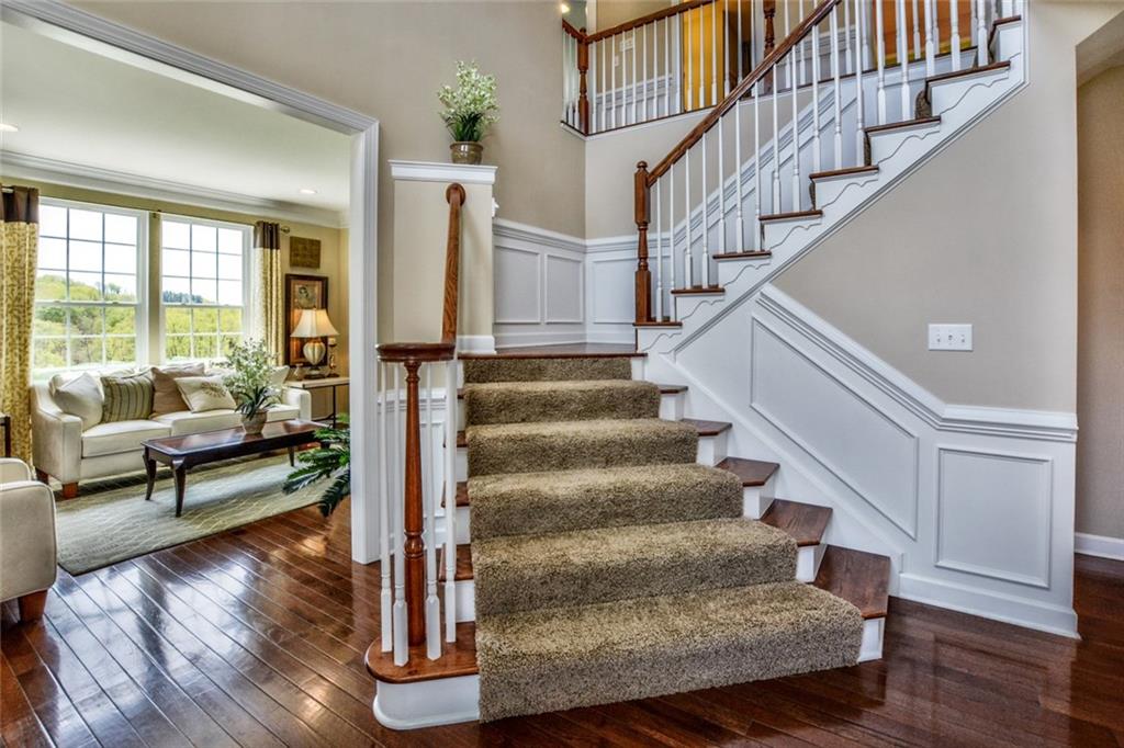 Two-Story Entry Way w/Hardwood Floors, Crown Moldings, Wainscoating