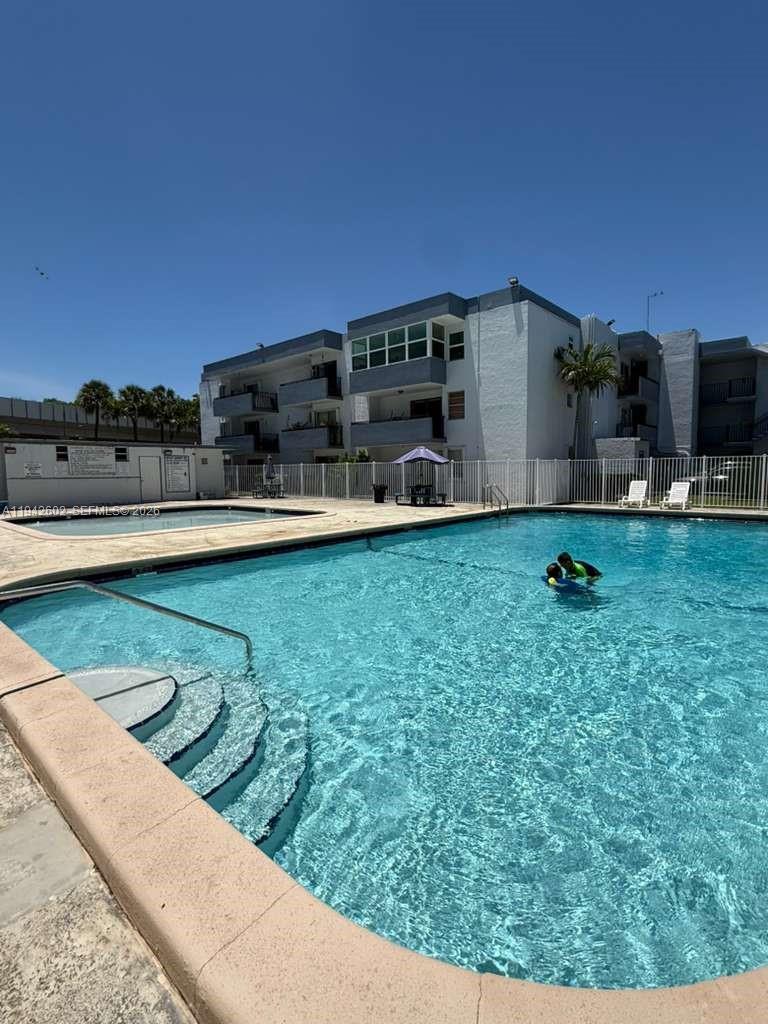 2498 Southwest 17th Avenue, Unit 4209 Miami, FL 33133 - Photo 15 of 15 a house view with swimming pool in front of it
