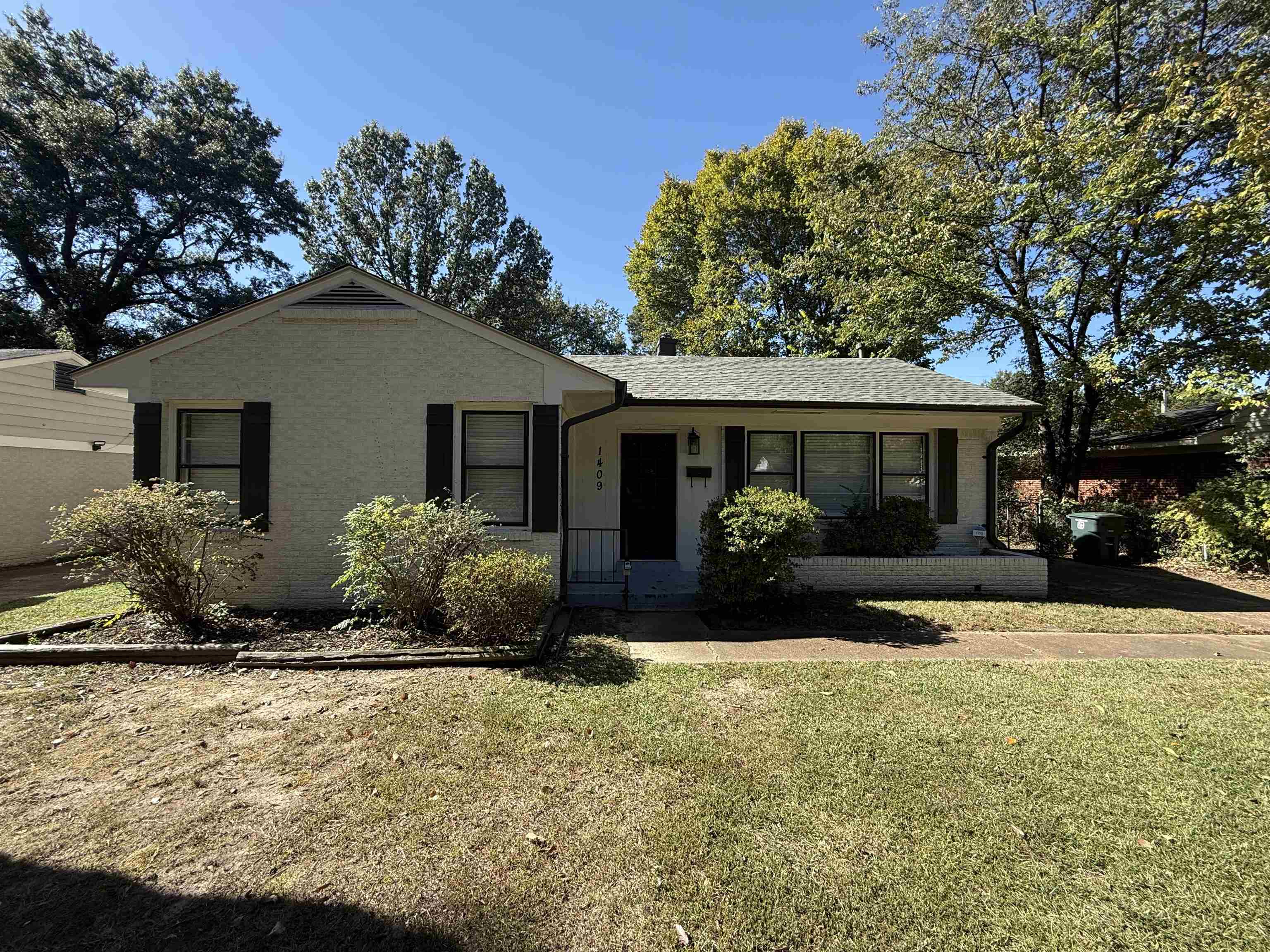 front view of a house with a yard