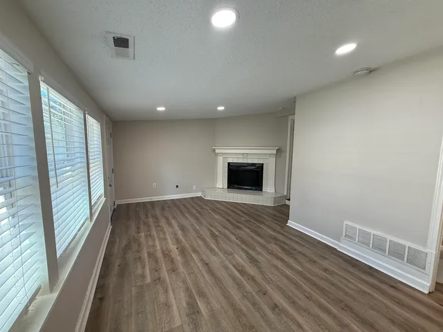 a view of house with deck and yard