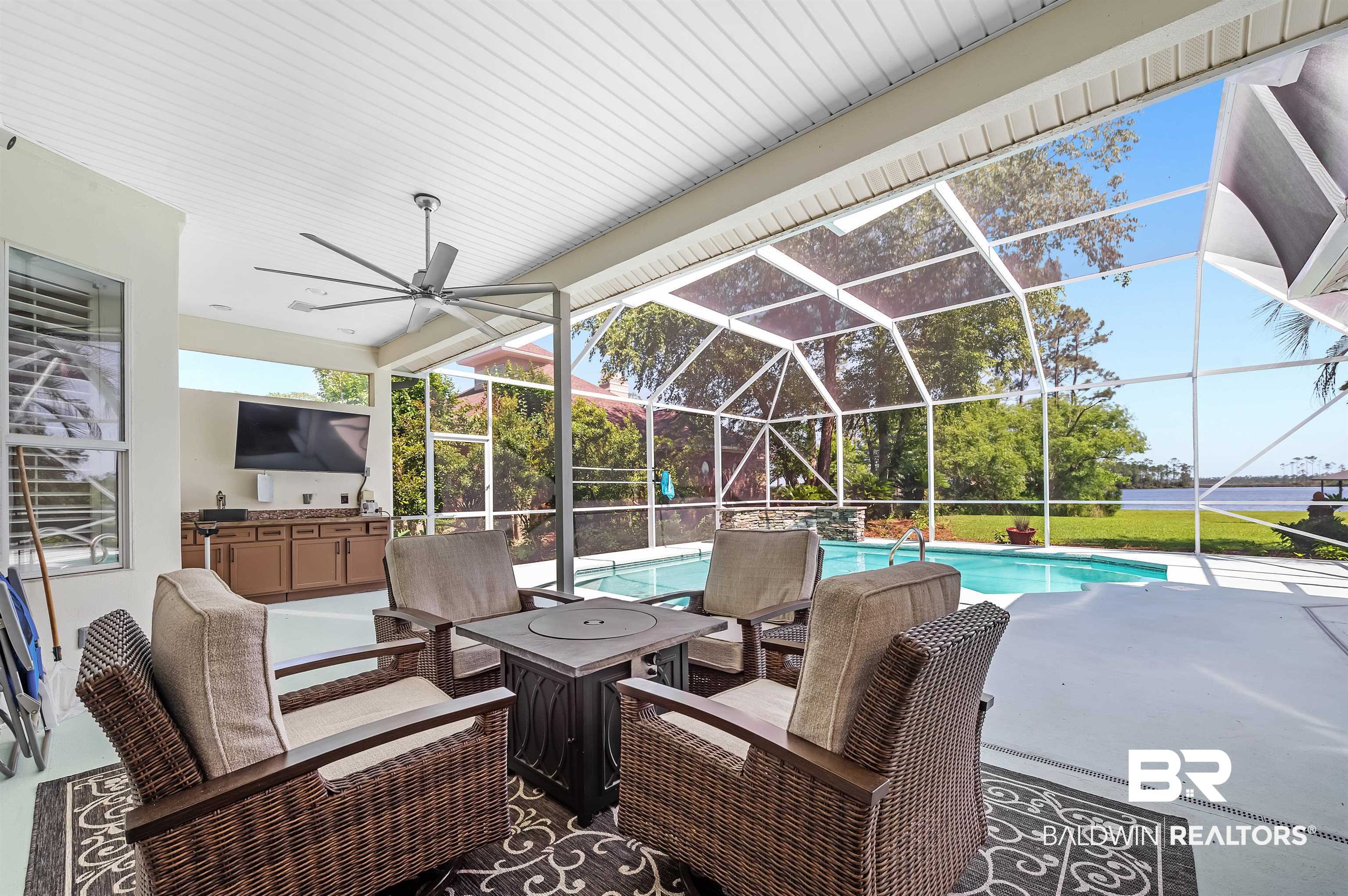 8160 Bay View Drive Foley, AL 36535 - Photo 31 of 43 View of patio featuring an outdoor pool, a ceiling fan, and a lanai