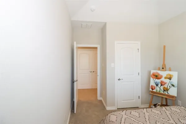 a view of an empty room and a window