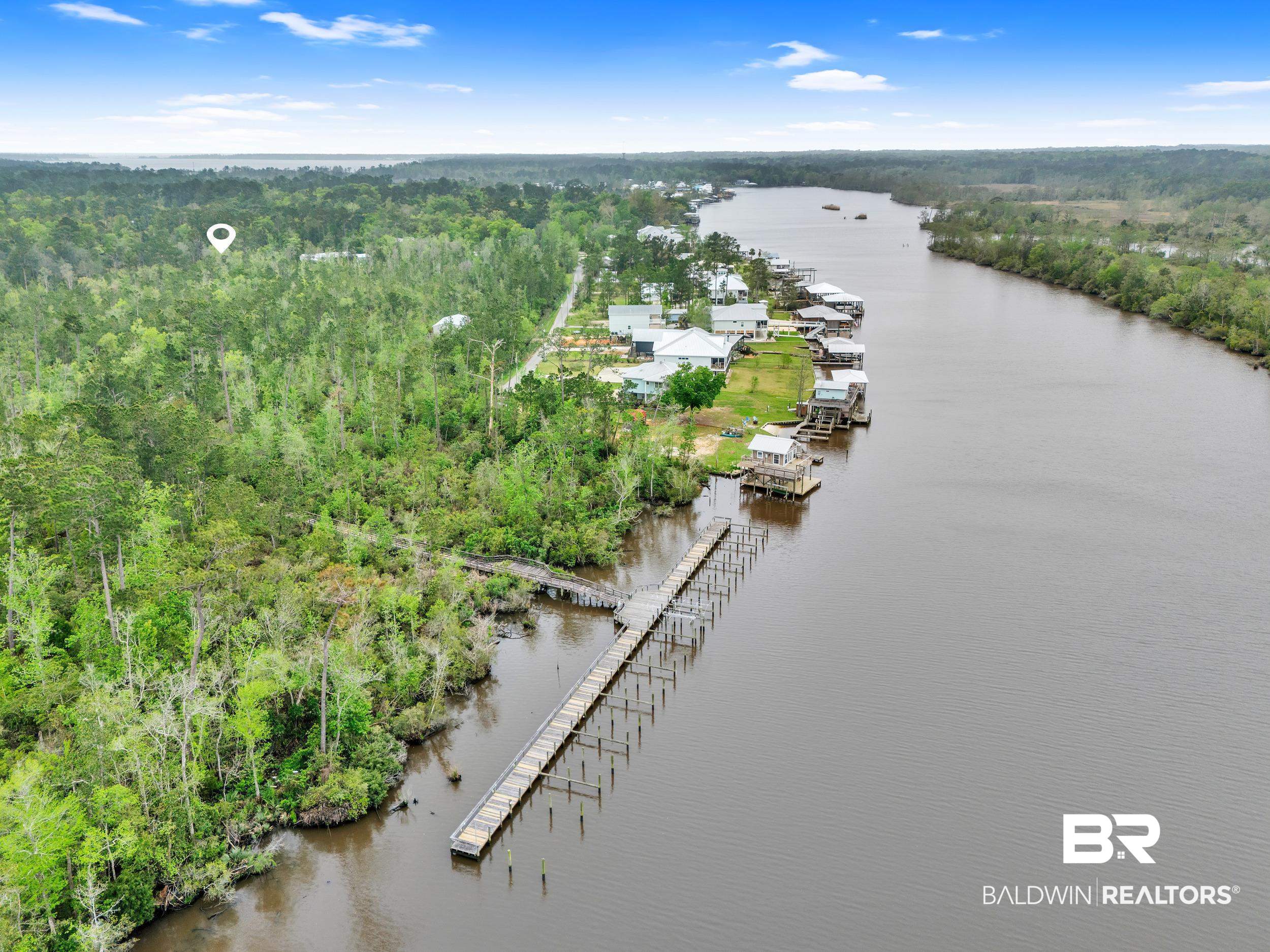 14179 Pandion Drive Foley, AL 36535 - Photo 1 of 16 Drone / aerial view with a water view and a view of trees