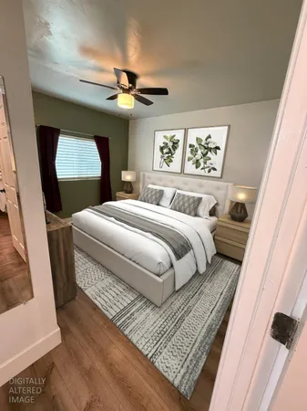 a bedroom with a bed and a mirror