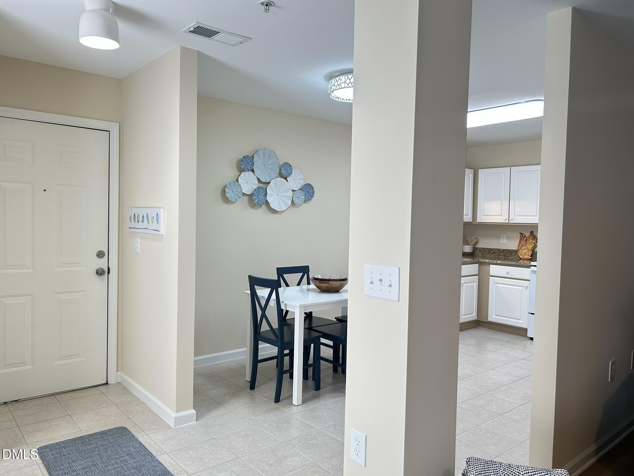 2510 Friedland Place, Unit 102 Raleigh, NC 27617 - Photo 6 of 42 a view of kitchen and dining area