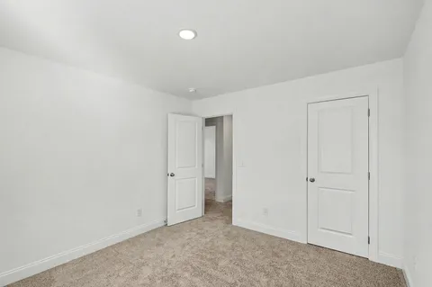 an empty room with closet area