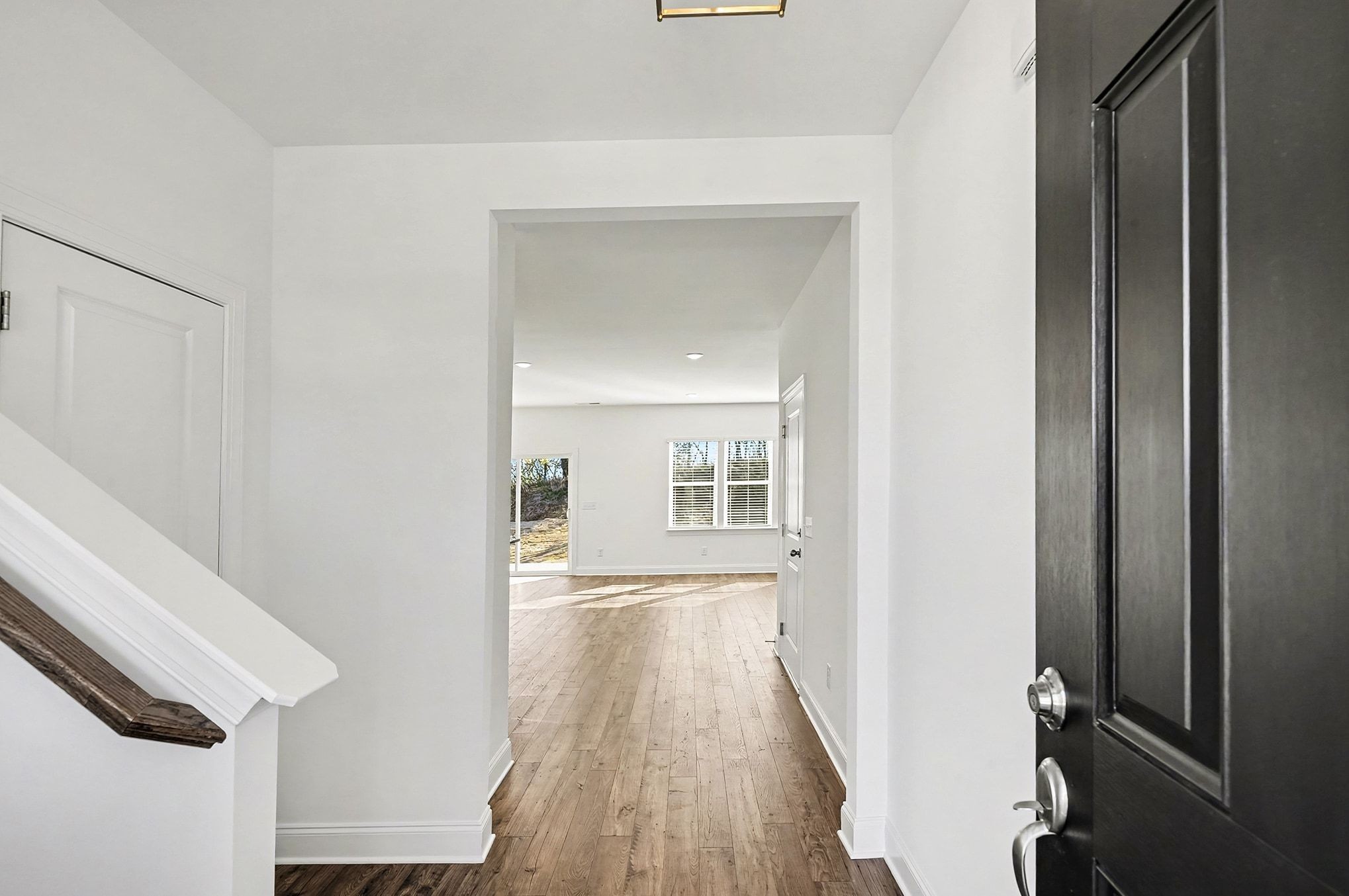 1029 Riverview Run Madison, TN 37115 - Photo 2 of 29 a view of a hallway with wooden floor and staircase