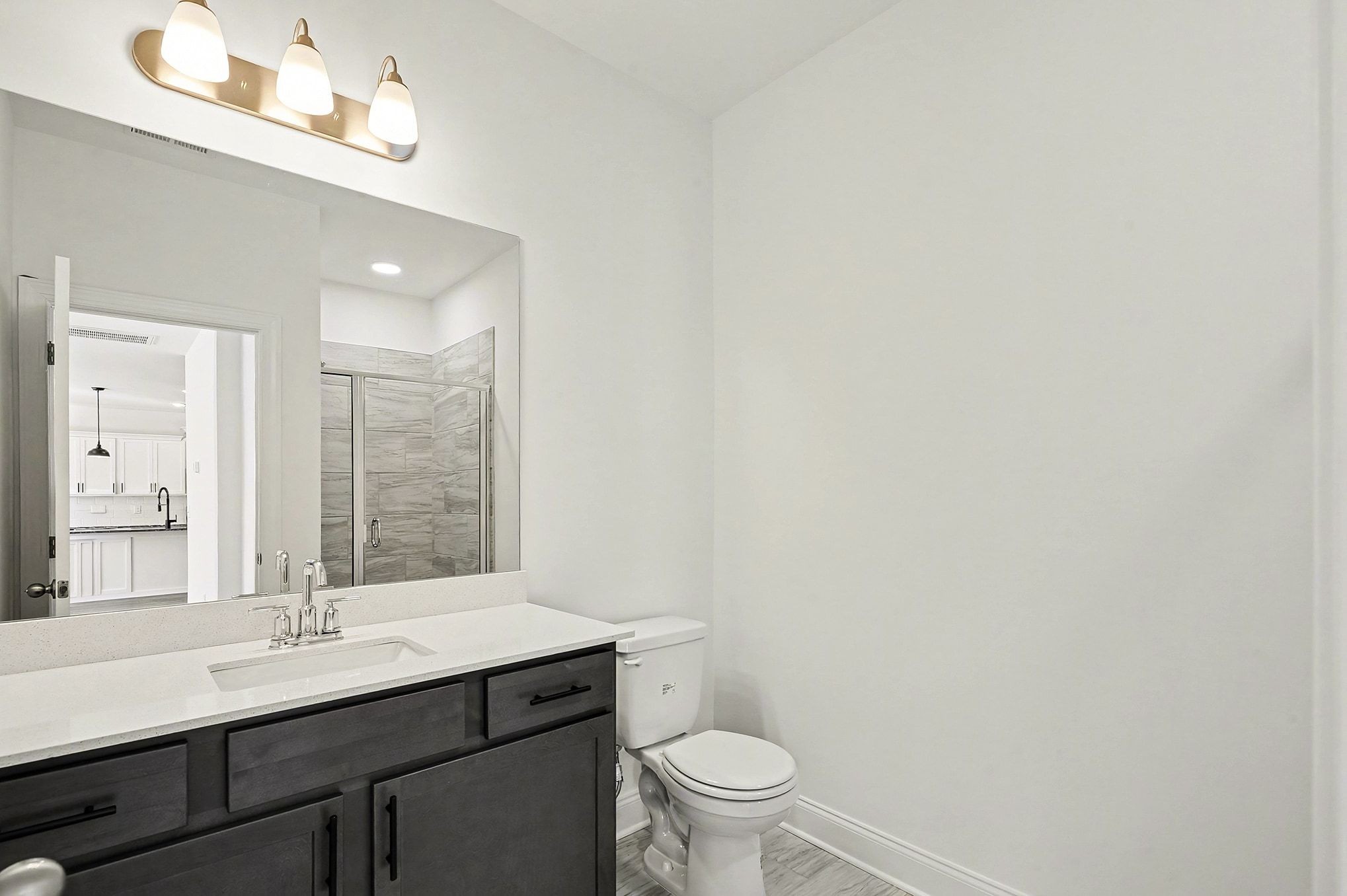 1029 Riverview Run Madison, TN 37115 - Photo 23 of 29 a bathroom with a sink a toilet a mirror and vanity