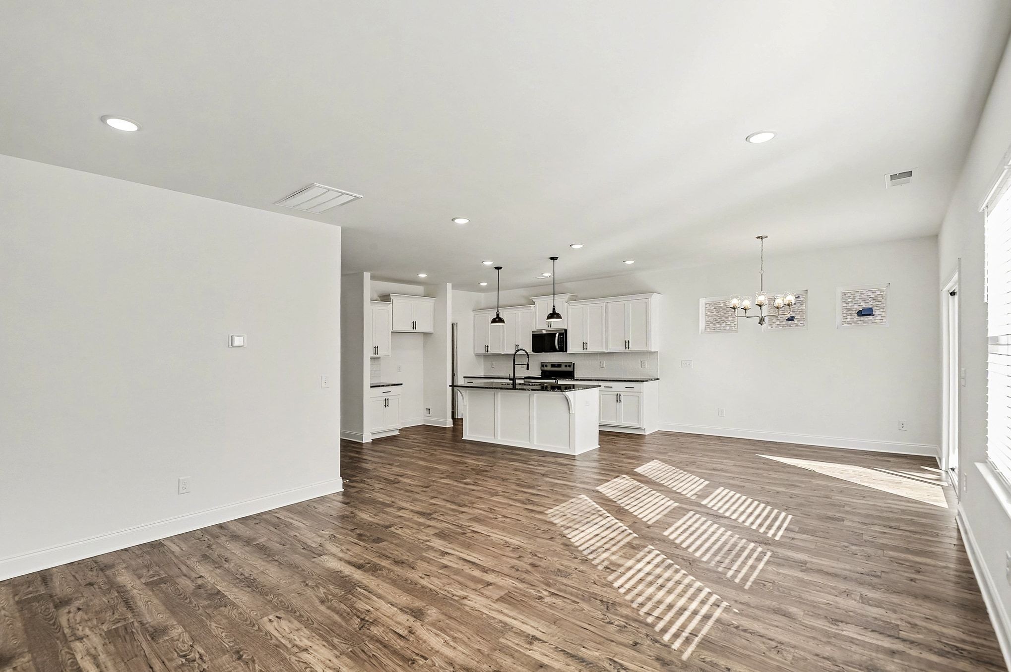 1029 Riverview Run Madison, TN 37115 - Photo 5 of 29 a kitchen with stainless steel appliances kitchen island granite countertop a refrigerator and a stove top oven