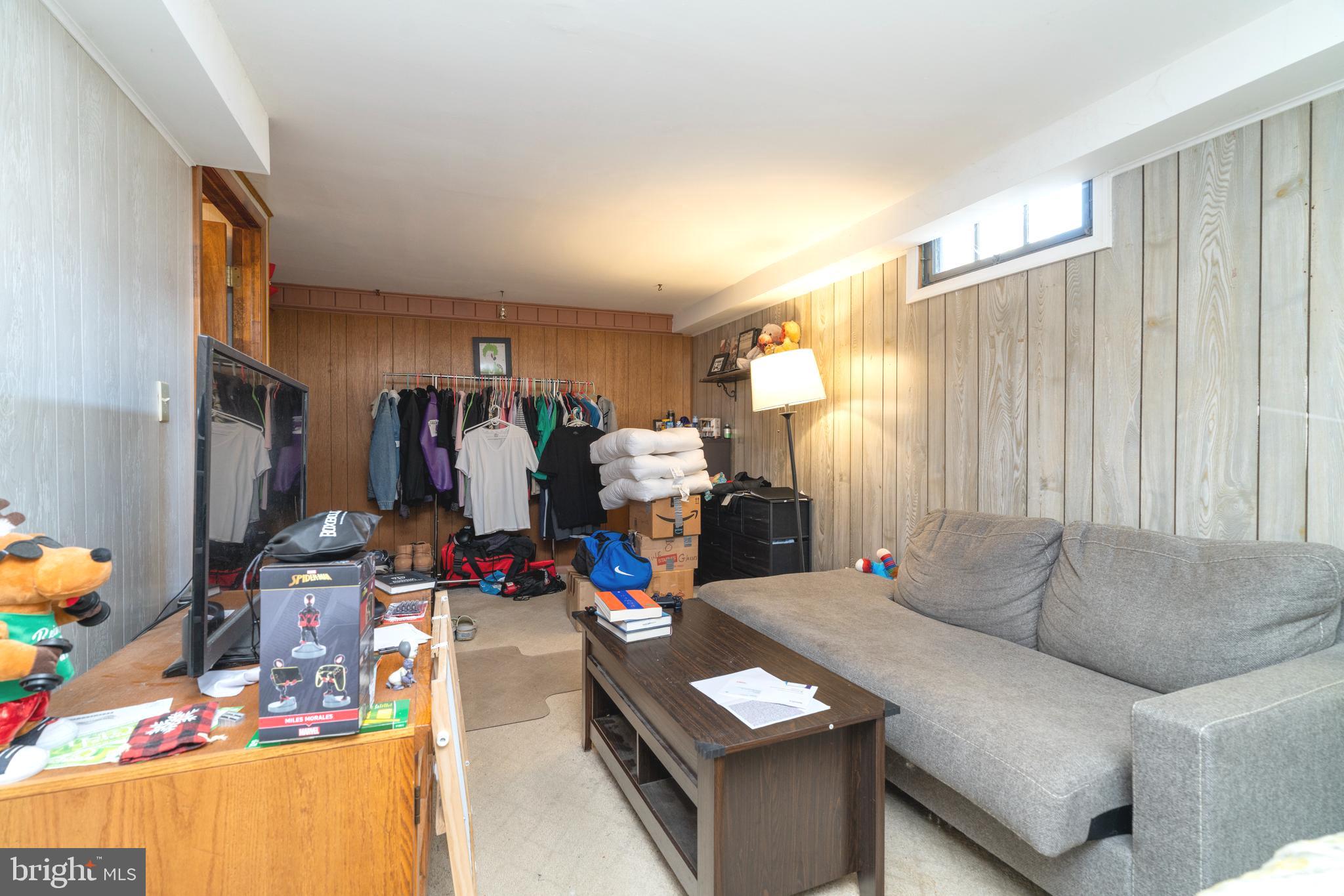 128 North Lynbrook Road Bel Air, MD 21014 - Photo 11 of 48 a living room with furniture and a gym equipment
