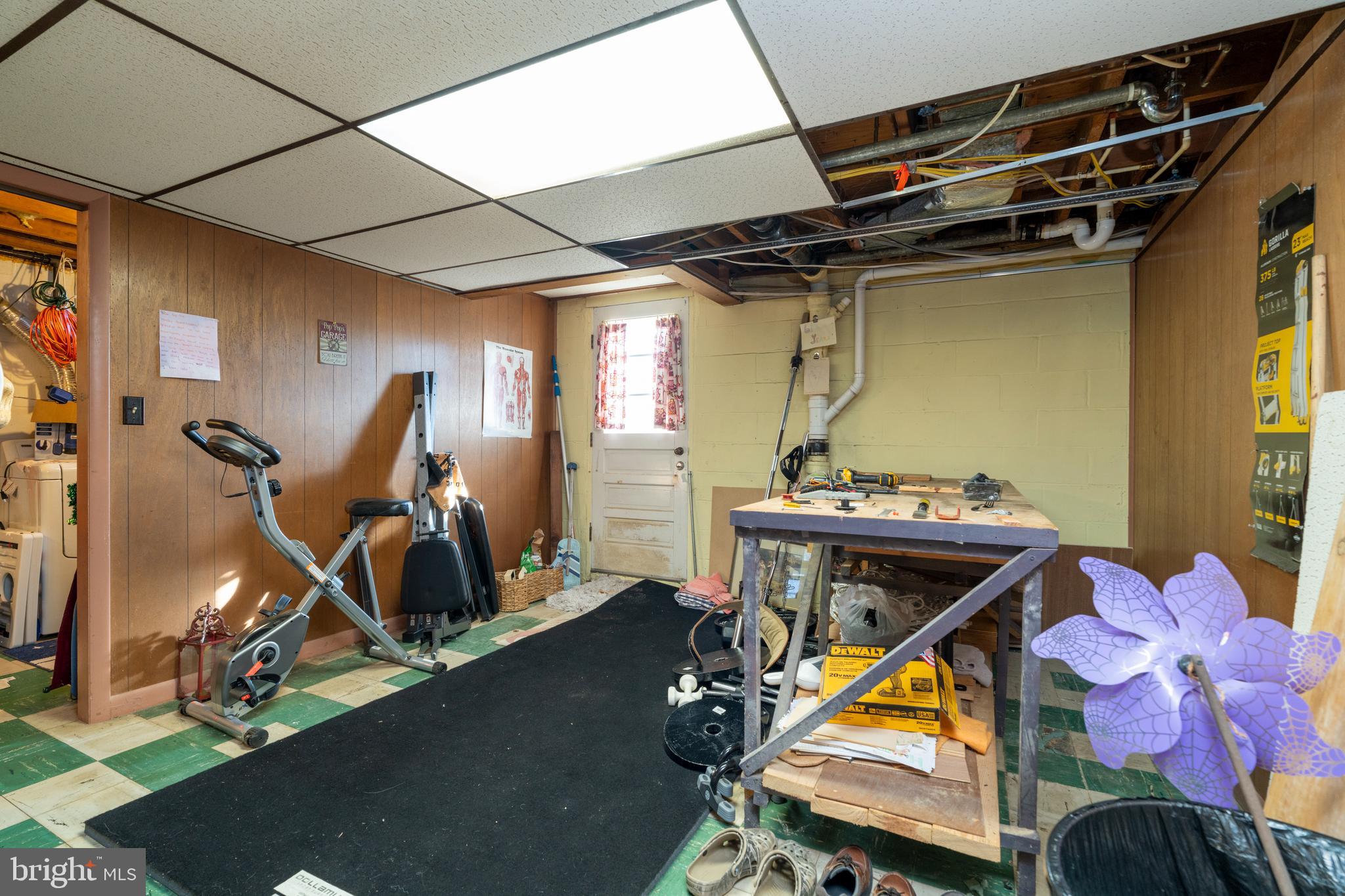 128 North Lynbrook Road Bel Air, MD 21014 - Photo 13 of 48 a room with gym equipment and wooden floor