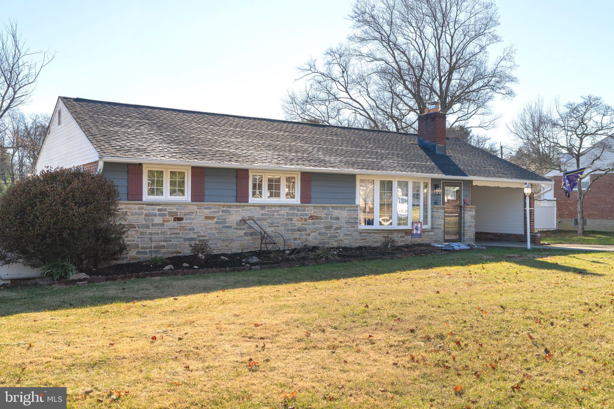 128 North Lynbrook Road Bel Air, MD 21014 - Photo 16 of 48 a front view of a house with a yard