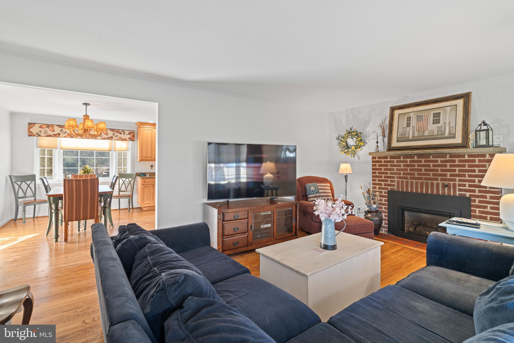 128 North Lynbrook Road Bel Air, MD 21014 - Photo 18 of 48 a living room with furniture a flat screen tv and a fireplace