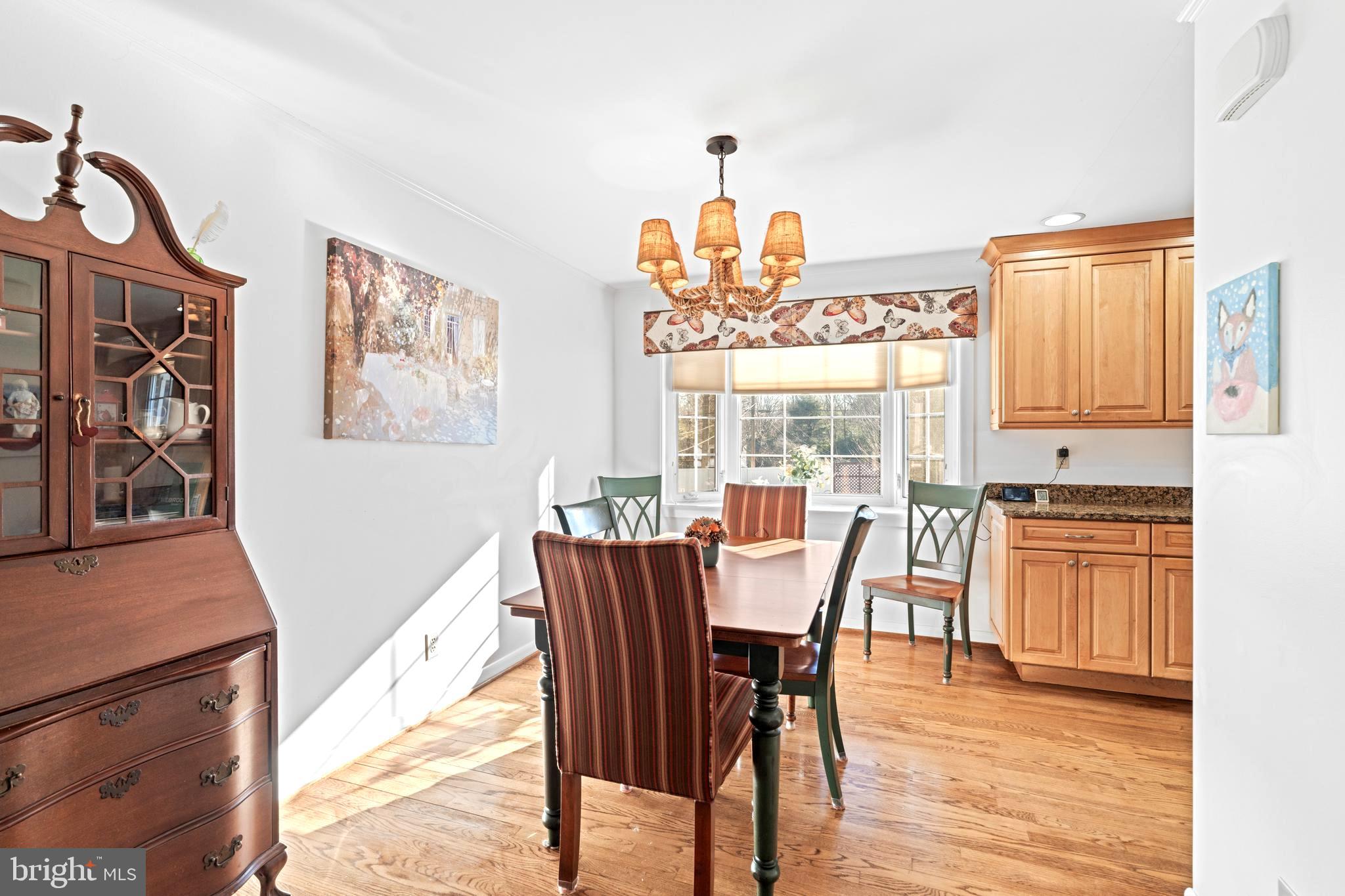 128 North Lynbrook Road Bel Air, MD 21014 - Photo 19 of 48 a dining room with furniture a chandelier and wooden floor