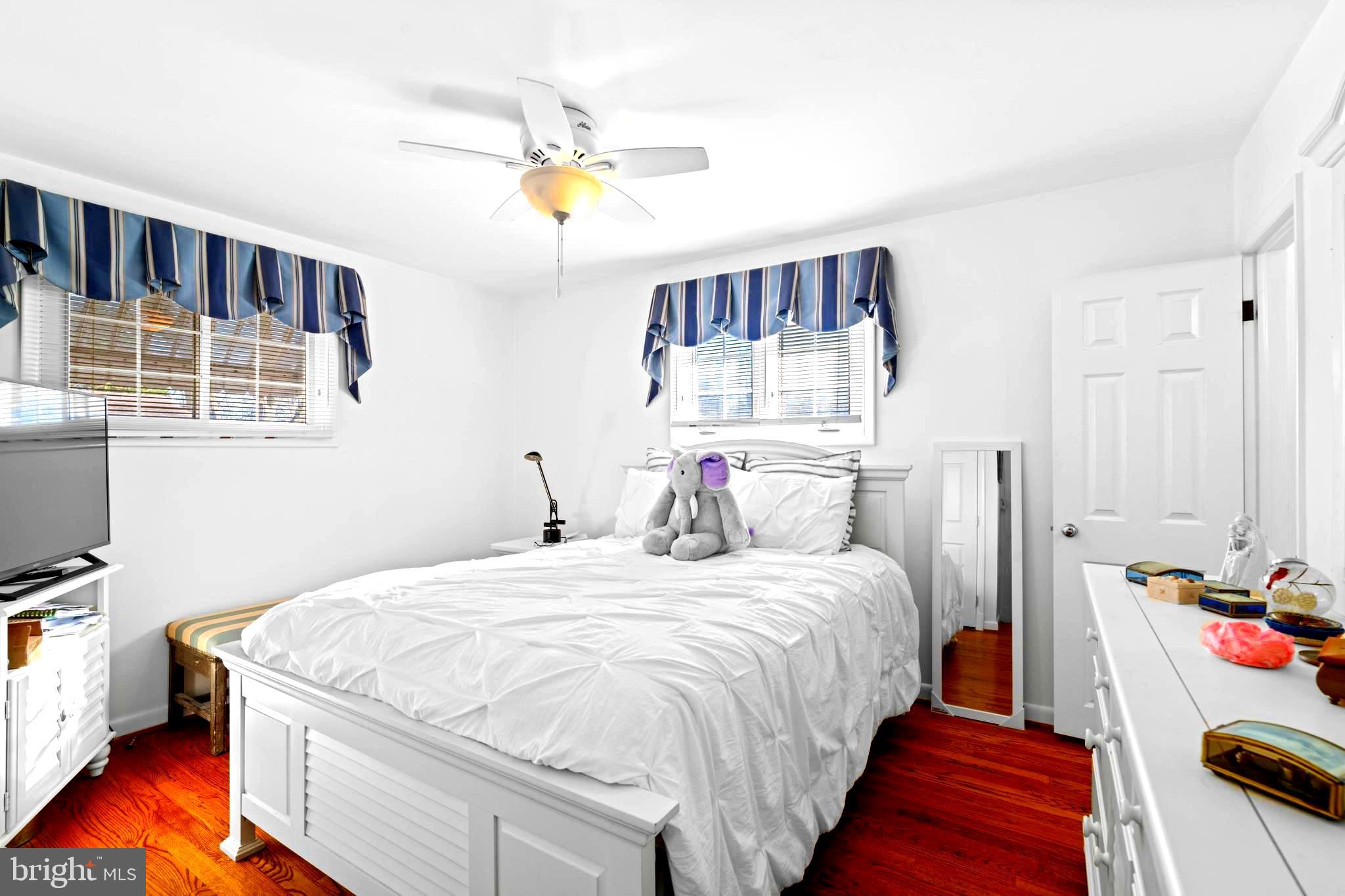 128 North Lynbrook Road Bel Air, MD 21014 - Photo 20 of 48 a bedroom with a bed and a chandelier