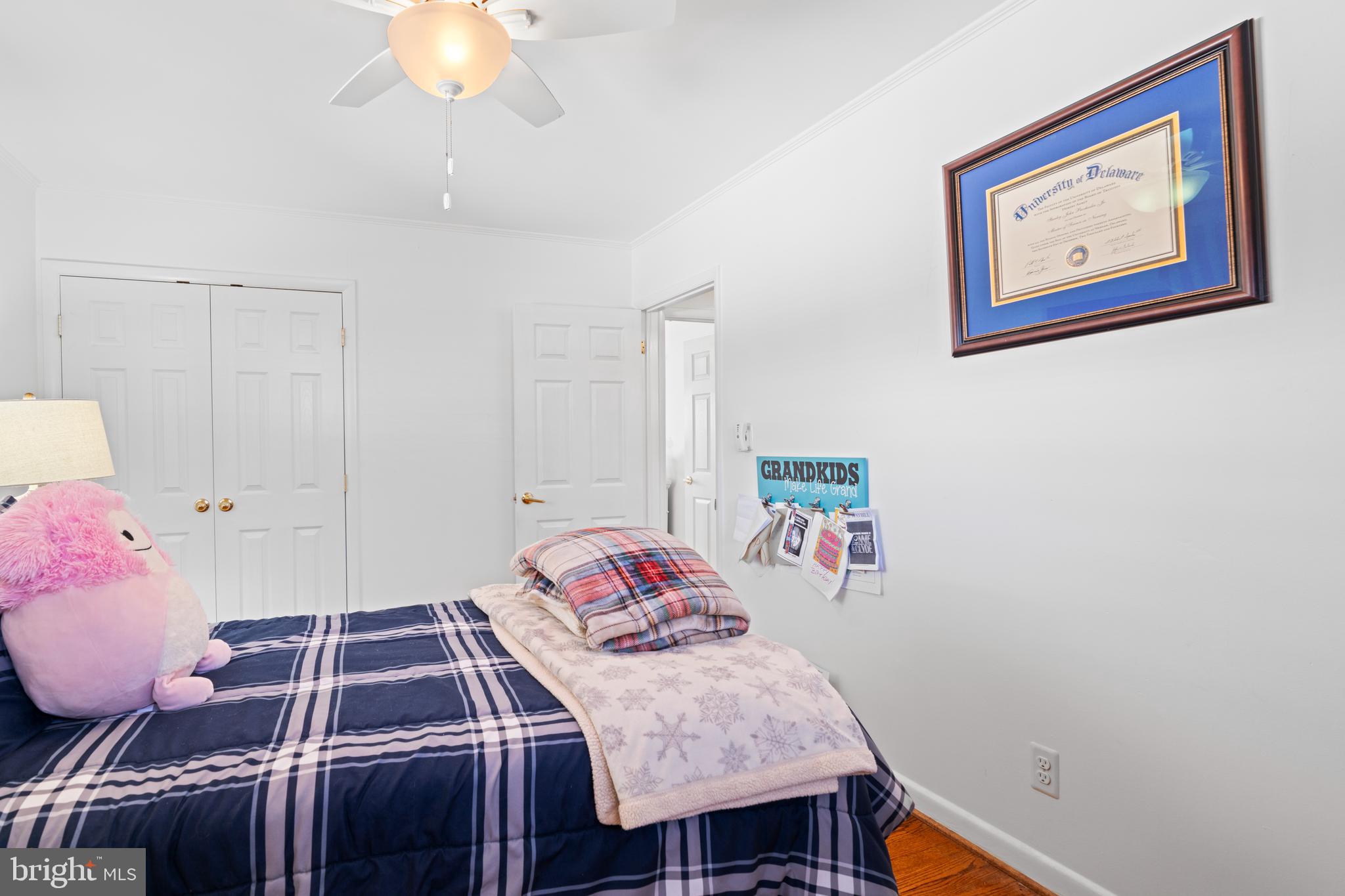 128 North Lynbrook Road Bel Air, MD 21014 - Photo 9 of 48 a bedroom with a bed and chandelier