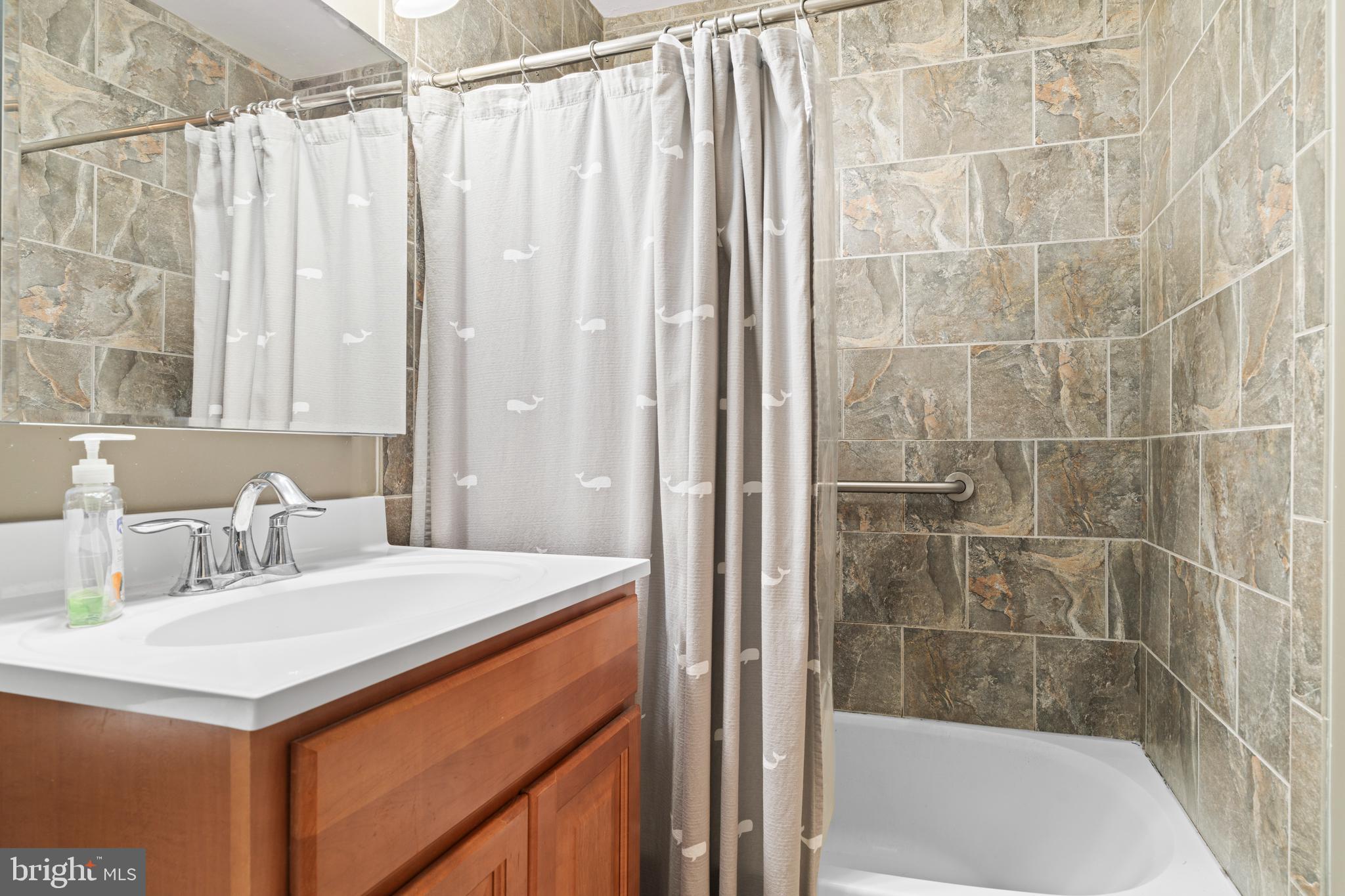 128 North Lynbrook Road Bel Air, MD 21014 - Photo 10 of 48 a bathroom with a sink and a shower
