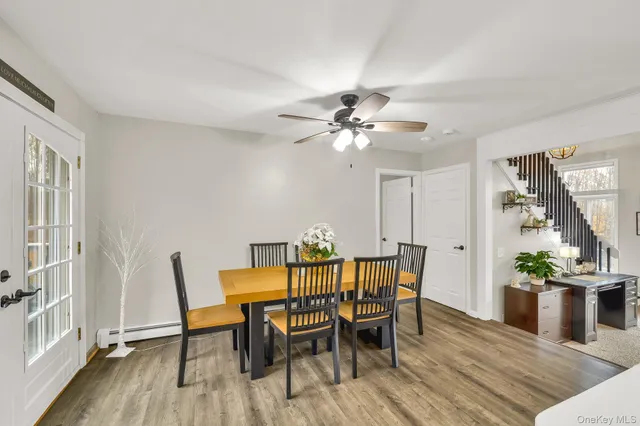 a large kitchen with a table and chairs