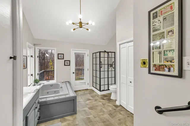 a bed room with a bed and a ceiling fan