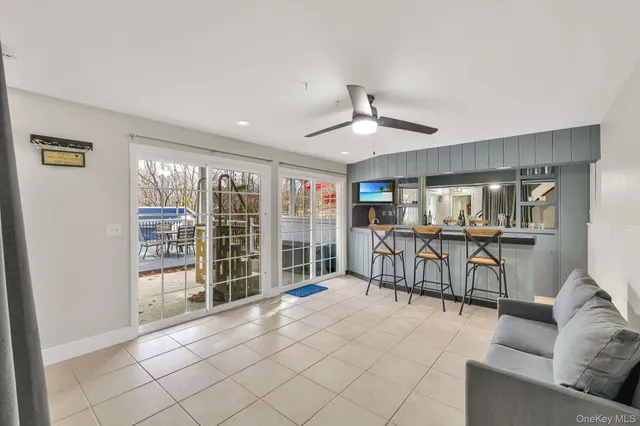 a room with gym equipment and a flat screen tv