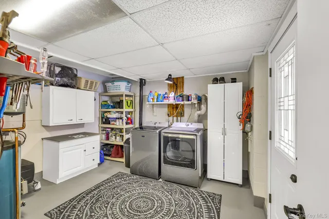 a living room with furniture a dining table and a large window