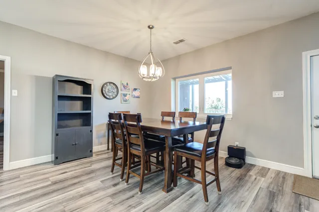 a kitchen with stainless steel appliances a stove microwave and refrigerator