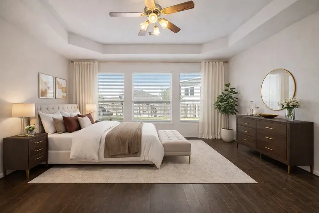 a living room with a bed furniture and a window