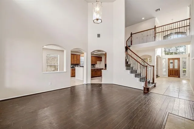 a view of an entryway with wooden floor