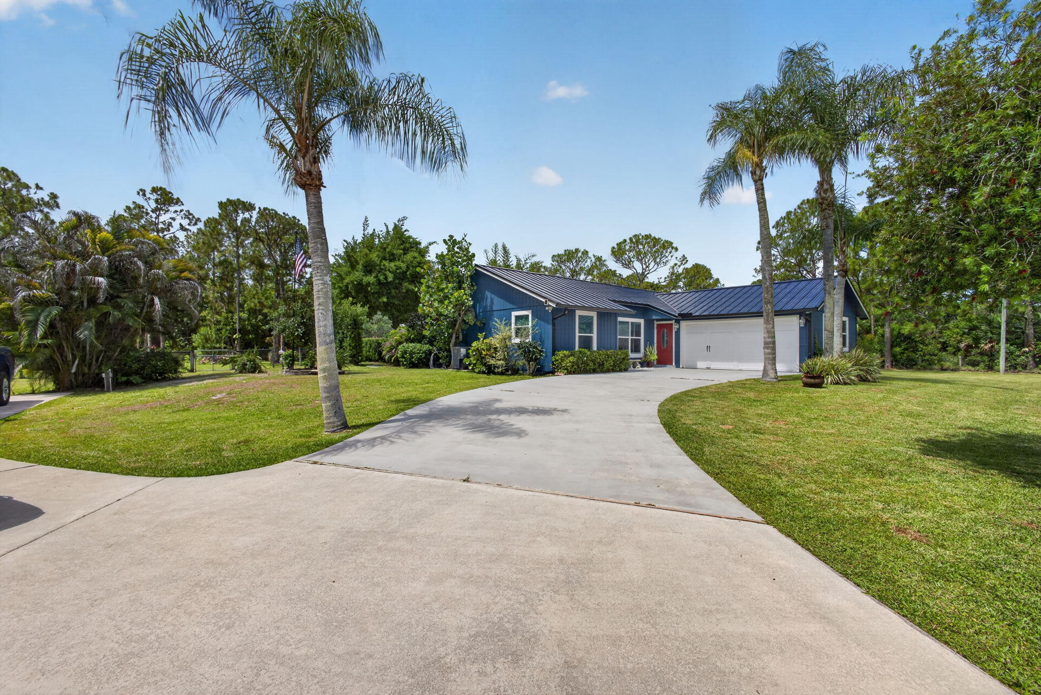 12558 165th Road North Jupiter, FL 33478 - Photo 5 of 67 a view of a house with a yard