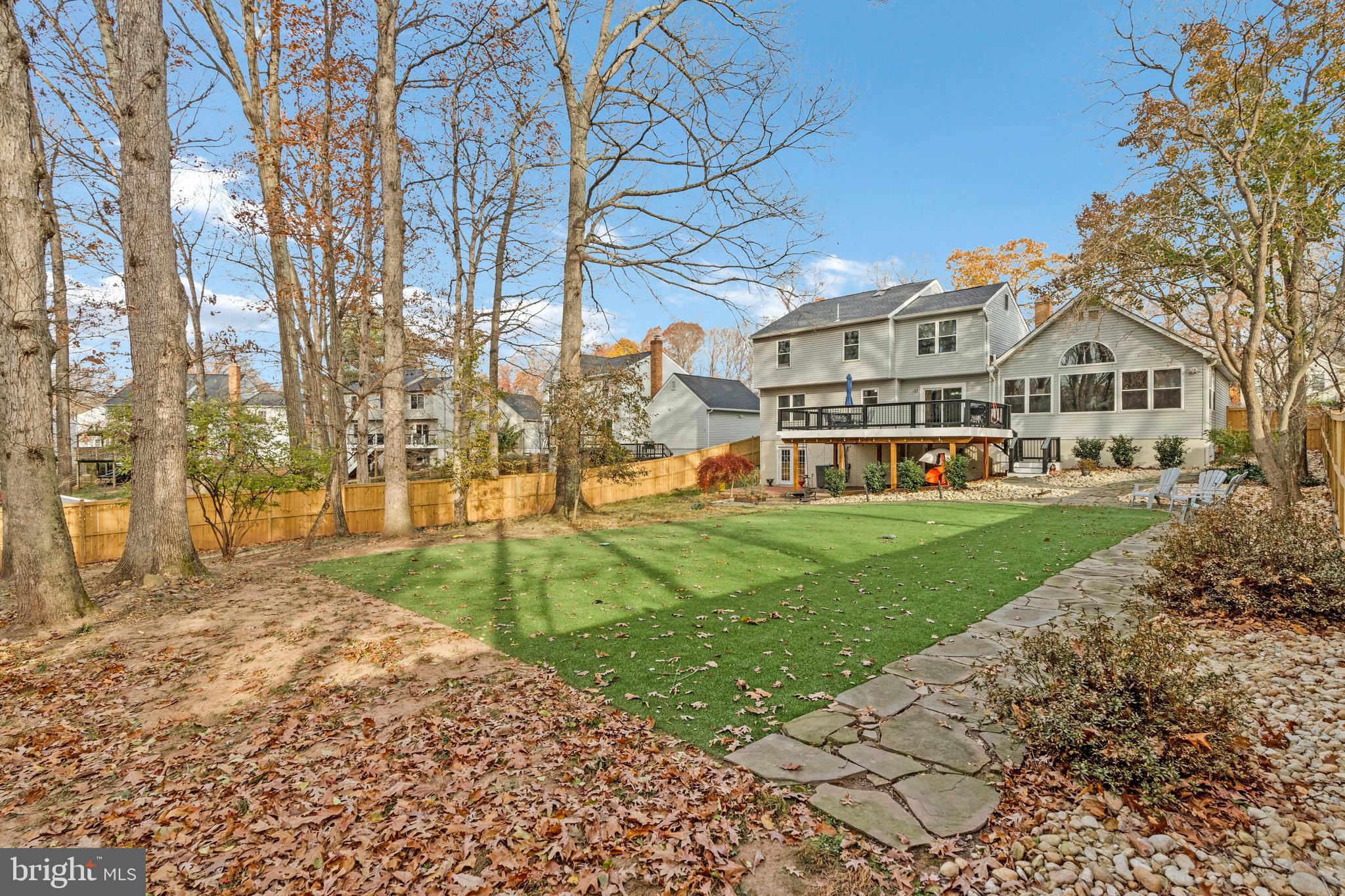 814 Potomac Ridge Court Sterling, VA 20164 - Photo 8 of 14 Flagstone walkways. Patio. New fence. 2025. WOW!
