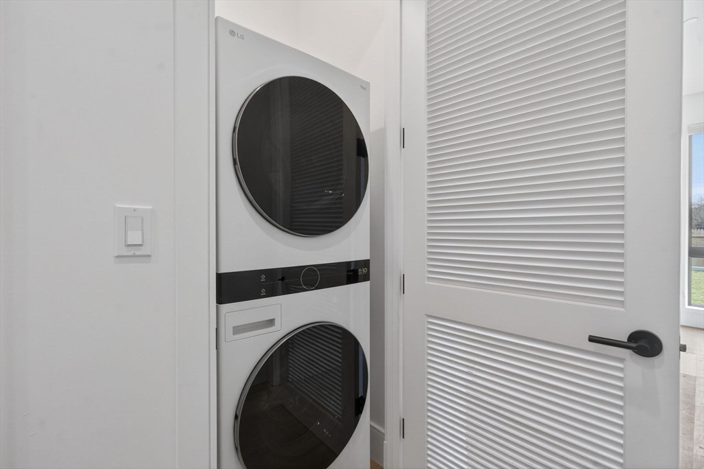 1114 Beacon Street, Unit 101 Newton, MA 02461 - Photo 11 of 29 a close up view of a washer and dryer