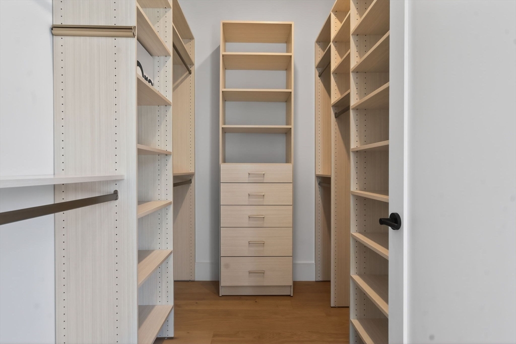1114 Beacon Street, Unit 101 Newton, MA 02461 - Photo 15 of 29 a view of walk in closet with empty racks