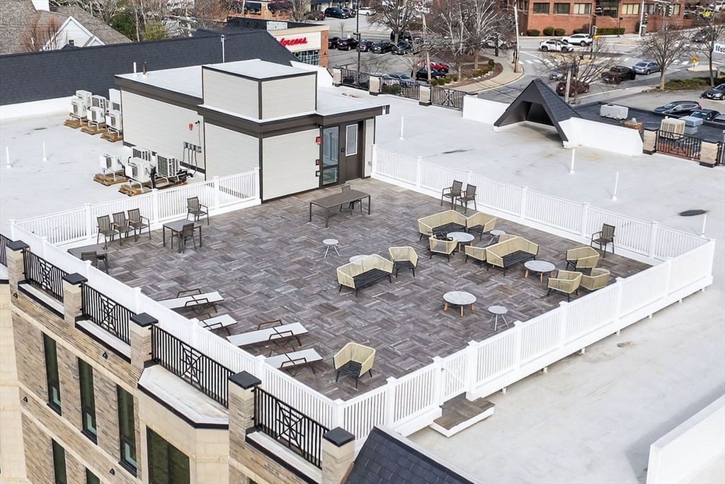 1114 Beacon Street, Unit 101 Newton, MA 02461 - Photo 23 of 29 a view of a house with outdoor space