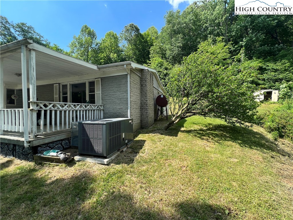455 Willowdale Church Road Vilas, NC 28692 - Photo 12 of 14 a view of a small house with wooden fence
