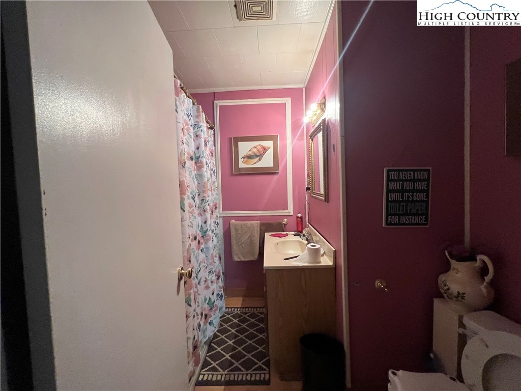 455 Willowdale Church Road Vilas, NC 28692 - Photo 10 of 14 a bathroom with a bathtub and shower