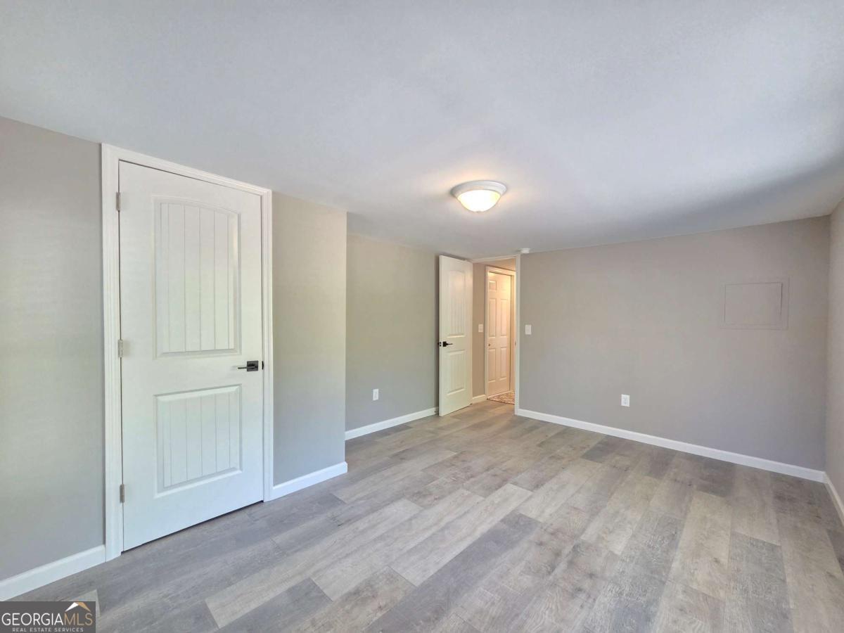 956 Donaldson Street Metter, GA 30439 - Photo 19 of 49 a view of an empty room and window
