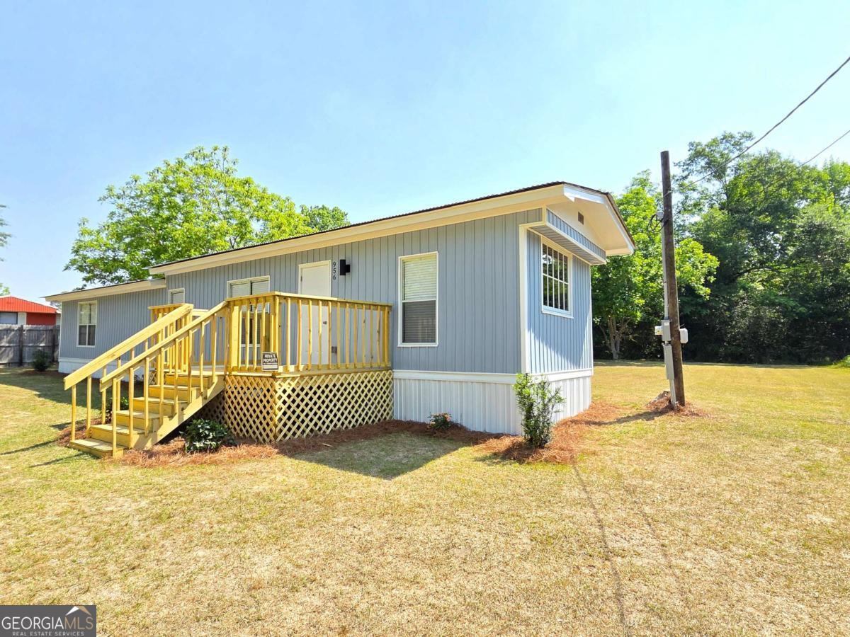 956 Donaldson Street Metter, GA 30439 - Photo 2 of 49 a view of a house with a yard