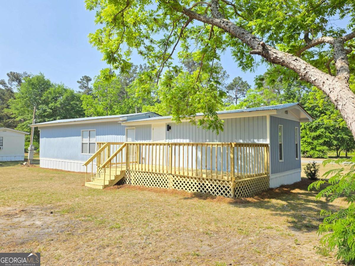 956 Donaldson Street Metter, GA 30439 - Photo 31 of 49 a view of a house with a outdoor space