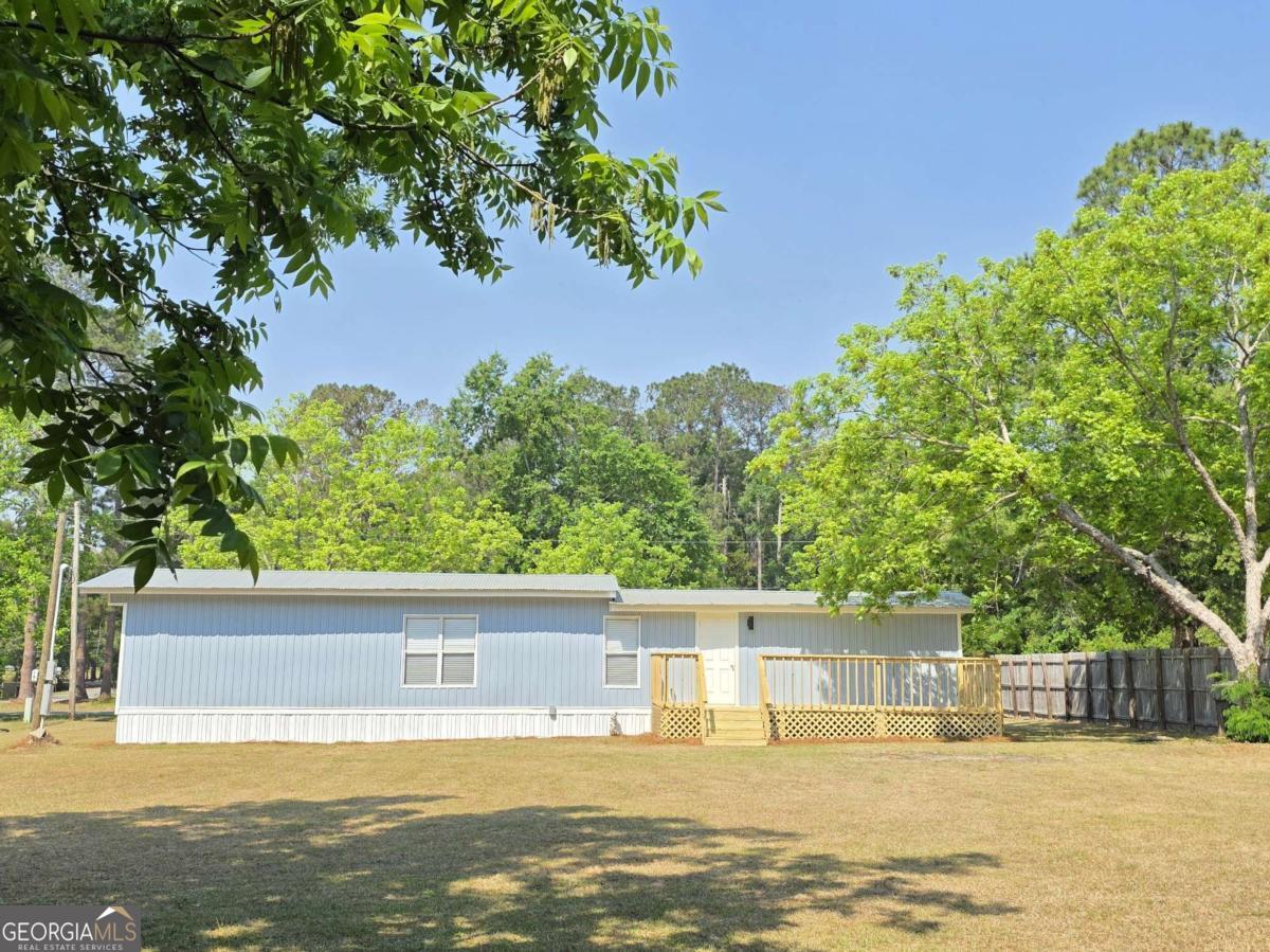 956 Donaldson Street Metter, GA 30439 - Photo 32 of 49 a view of a swimming pool with an ocean view