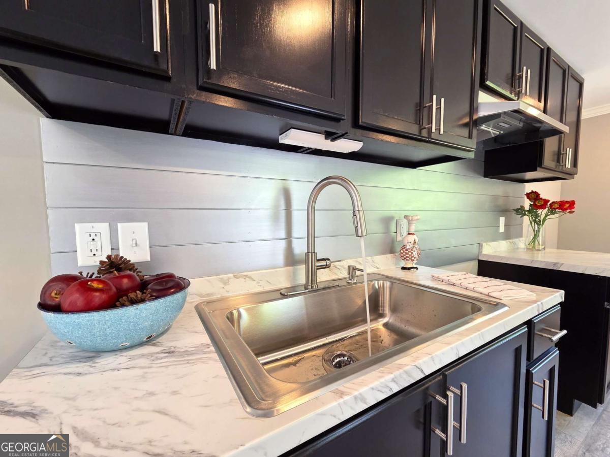 956 Donaldson Street Metter, GA 30439 - Photo 10 of 49 a kitchen with a sink and a stove