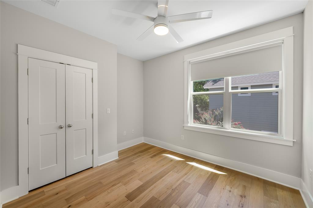 2821 Castro Street, Unit 1 Austin, TX 78702 - Photo 16 of 21 Hardwood-style flooring throughout, complemented by a contemporary ceiling fan