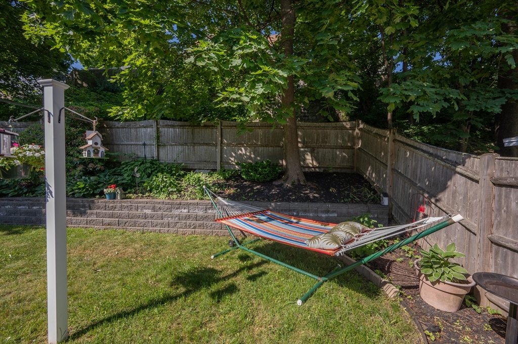 29 Wituwamat Road Weymouth, MA 02191 - Photo 37 of 42 a view of a backyard with chair and table