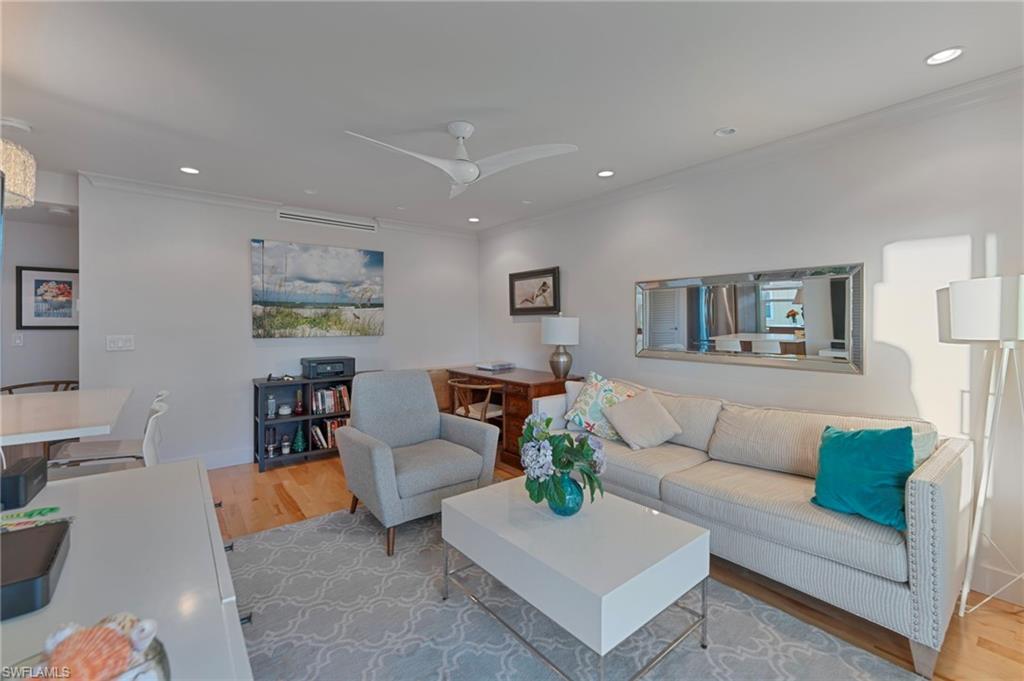 291A 8th Avenue South, Unit 291B Naples, FL 34102 - Photo 2 of 10 a living room with furniture and a couch