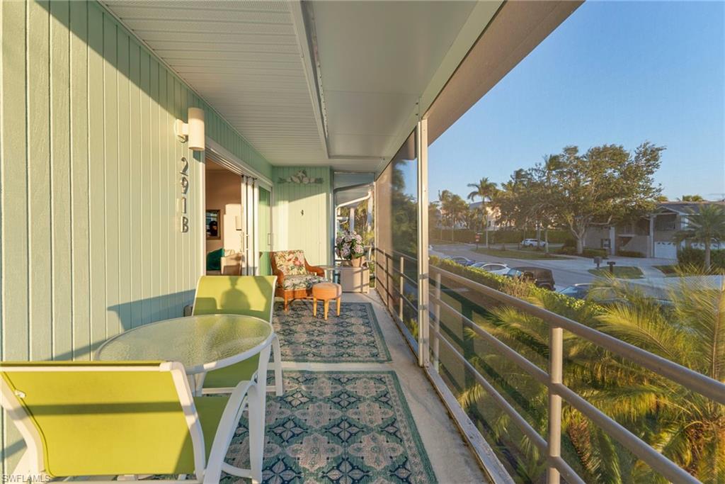 291A 8th Avenue South, Unit 291B Naples, FL 34102 - Photo 9 of 10 Balcony with outdoor dining area