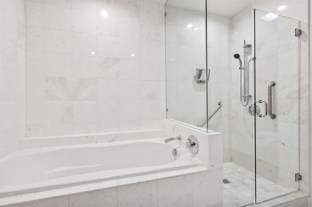 3030 Bryan Street, Unit 409 Dallas, TX 75204 - Photo 17 of 30 a bathroom with a bathtub and a shower