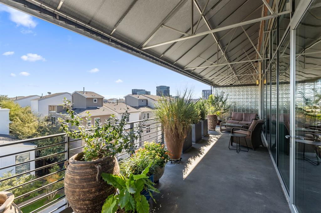 3030 Bryan Street, Unit 409 Dallas, TX 75204 - Photo 20 of 30 a view of a chairs and table in the balcony