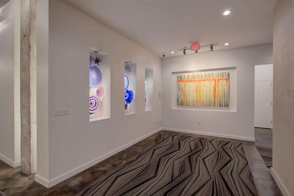 3030 Bryan Street, Unit 409 Dallas, TX 75204 - Photo 22 of 30 a view of a livingroom with wooden floor