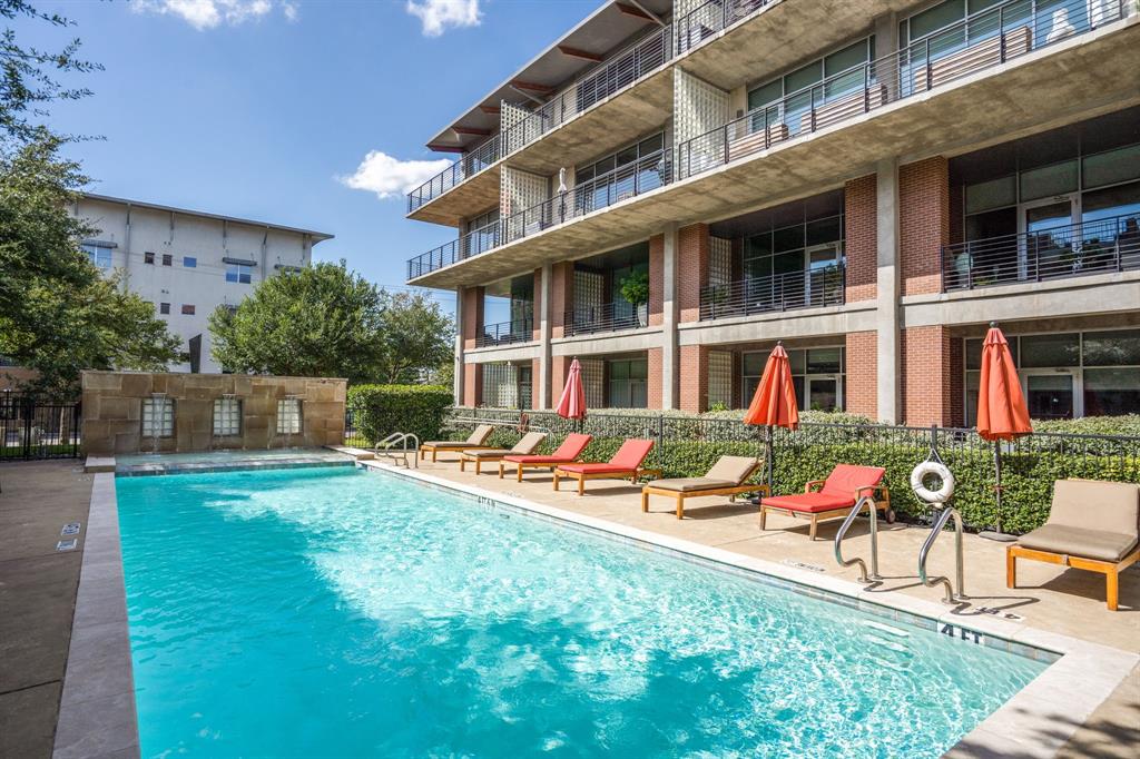 3030 Bryan Street, Unit 409 Dallas, TX 75204 - Photo 25 of 30 front view of a brick house with a yard
