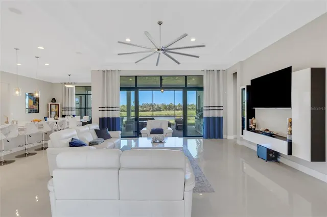 a living room with furniture a rug and a window